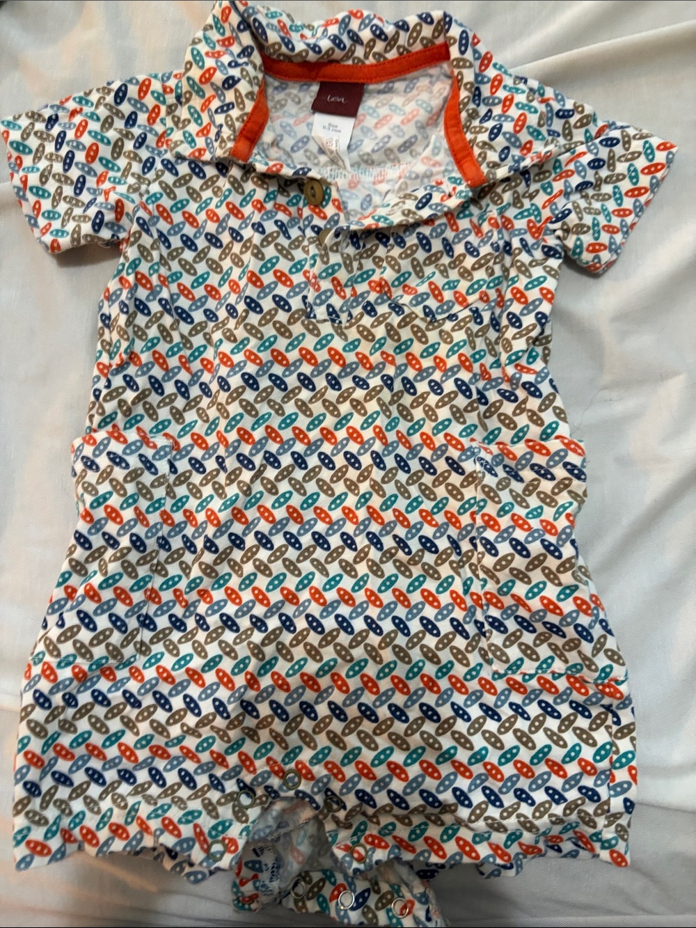 Tea Collection White Romper with Blue, Orange, and Brown Surfboard Motif